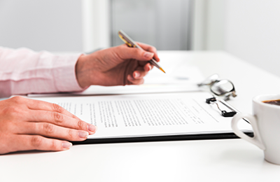 man signing legal documents 